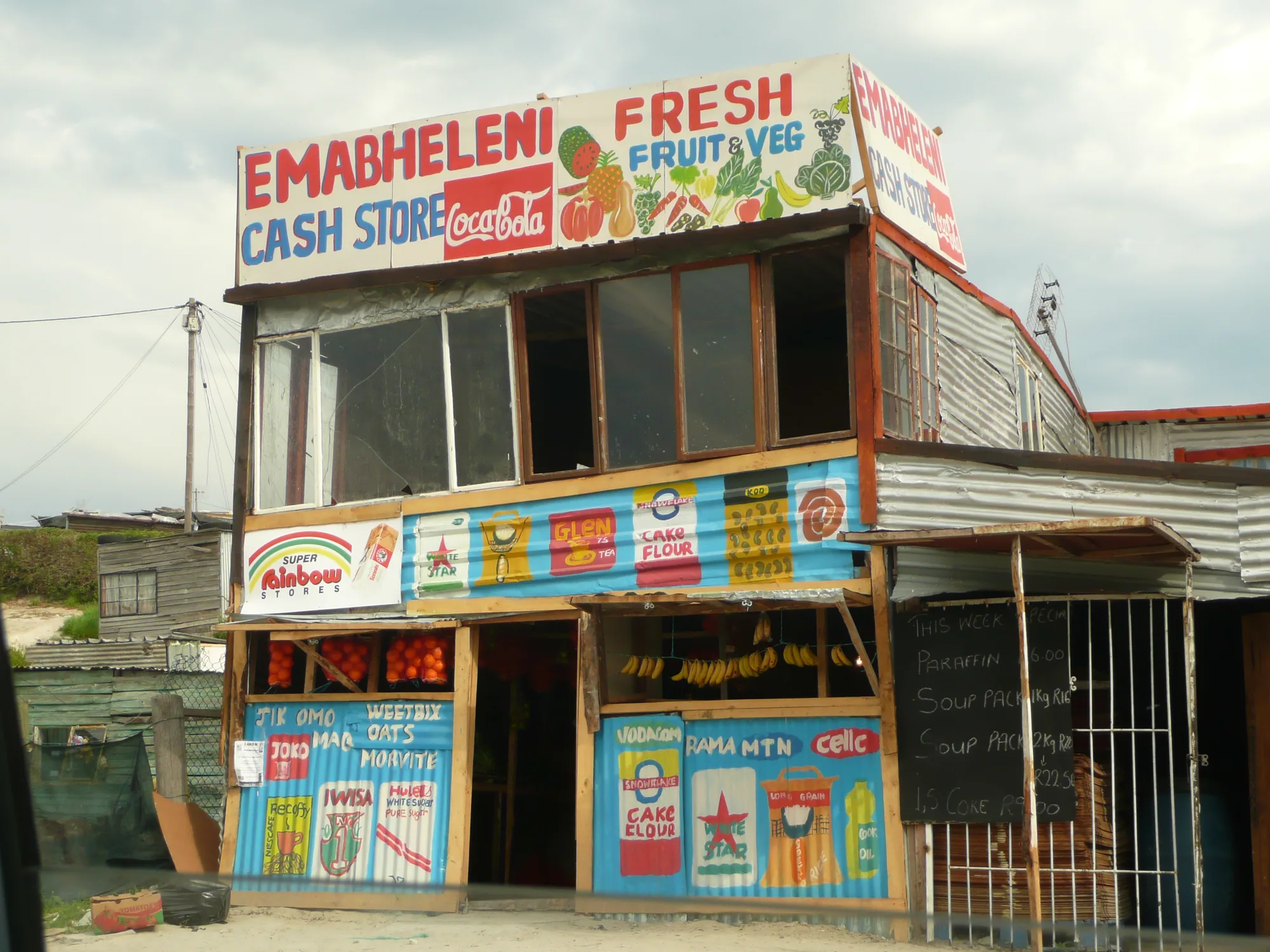 A township cash store, painted and lettered by hand, built and run locally